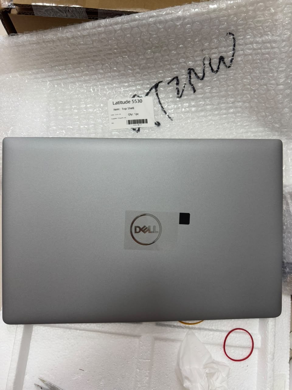 Dell Latitude 5530 laptop top shell with fingerprint reader and silver logo.
