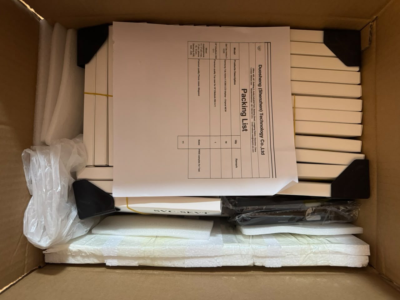 Wholesale repair parts packed with foam padding and corner protectors inside cardboard box.