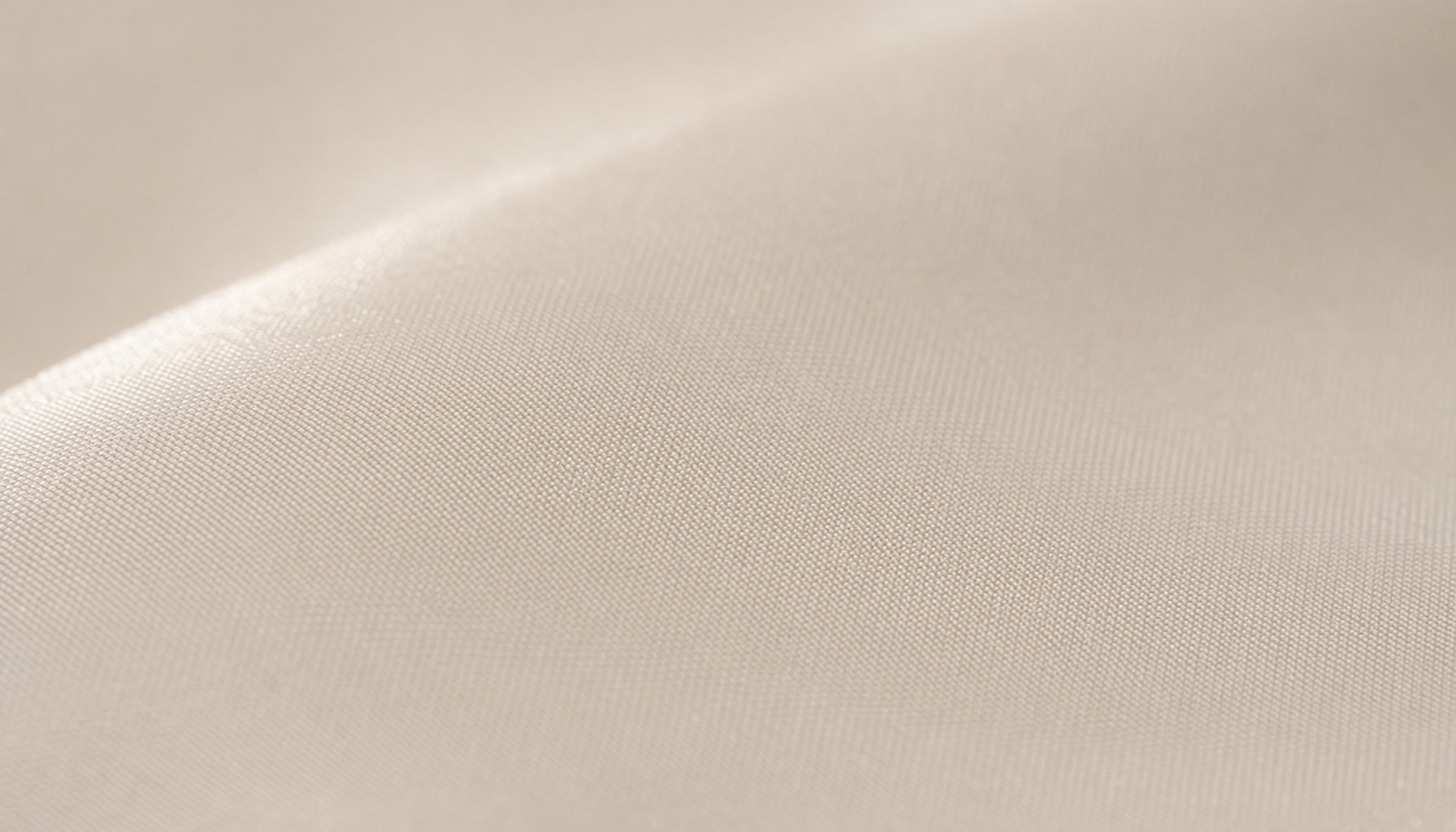 Premium double-brushed microfiber sheet surface close-up showing buttery-soft velvety plush texture in natural light
